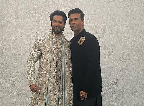 (L) Bollywood actor Varun Dhawan poses on his wedding day with director (R) Karan Johar (Photo | Karan Johar, Instagram)