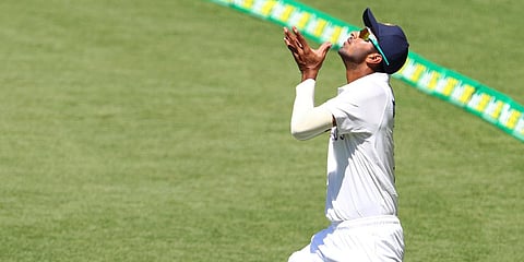 Washington Sundar reaches to catch the ball ahead of play on 2nd Day of the 4th Test against Australia. (Photo| AP)