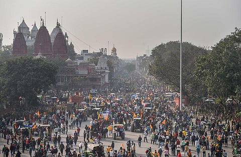 Farmers gathered in front of Red Fort after their tractor parade on Republic Day. (Photo | PTI)