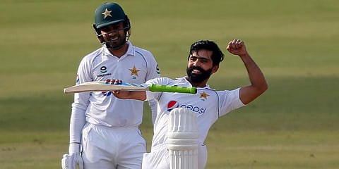 Pakistan's Fawad Alam (R) celebrates after scoring century while Faheem Ashraf watches during the second day of the first Test match against South Africa at the National Stadium. (Photo | AP)