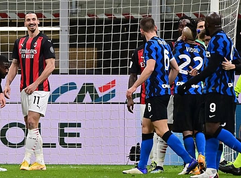 AC Milan's Swedish forward Zlatan Ibrahimovic (L) argues with Inter Milan's Belgian forward Romelu Lukaku (R) at the end of the first half of the Italian Cup quarter final. (Photo | AFP)