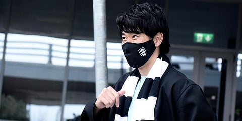 Japanese soccer player Shinji Kagawa gestures, upon his arrival at the airport in the northern city of Thessaloniki, Greece. (Photo | AP)