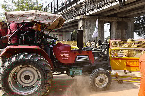 A tractor tries to break a police barricade near Akshardham in New Delhi. (Photo | EPS)