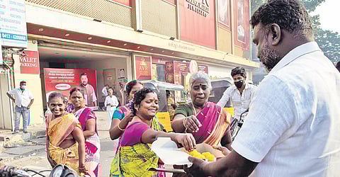 Former minister Namassivayam’s supporters burst crackers and distribute sweets in Puducherry on Wednesday | G PATTABI RAMAN