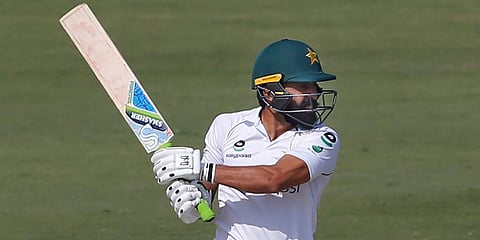 Pakistan's batsman Fawad Alam follows the ball after playing a shot for boundary during the second day of the first Test match against South Africa at the National Stadium, in Karachi. (Photo | AP)