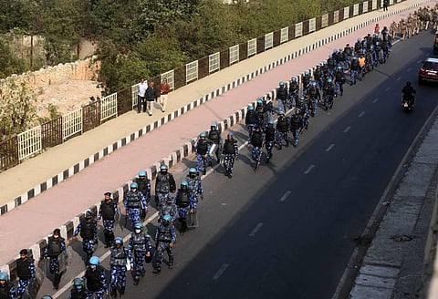 Security personnel conduct a flag march at Ghazipur border during the ongoing farmers agitation against Centres farm reform laws. (Photo | Parveen Negi/EPS)