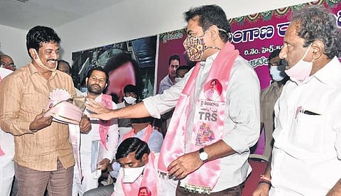 Amid speculations of his coronation as the next Chief Minister, TRS working president KT Rama Rao refuses to wear a crown-like turban being offered by a TRVKS member at Telangana Bhavan in Hyderabad o