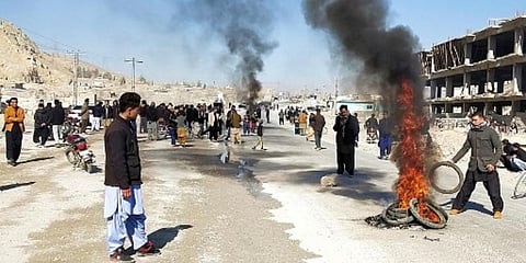 Members of Shiite Hazara community burn tyres during a protest after the killing of 11 workers of their community, in Quetta on January 3. (Photo| AFP)