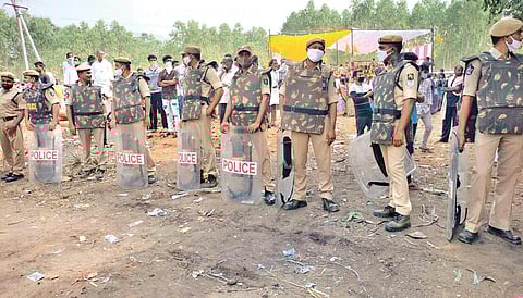 Police put up barricades on the roads leading to Bodikonda in view of tense situation at Ramatheertham in Vizianagaram district on Saturday I Express