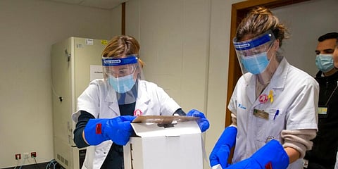 Medical staff receive part of a Pfizer-BioNTech Covid-19 vaccine shipment. (File Photo | AP)