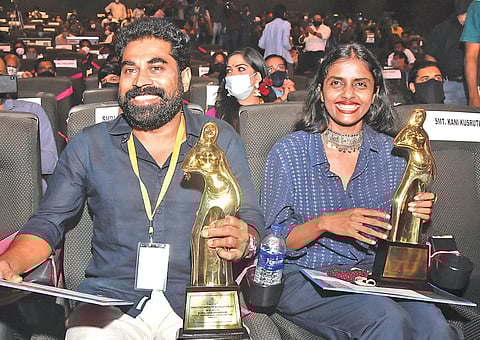 Best actors Suraj Venjarammoodu and Kani Kusruthi with the awards at the state film award function at Tagore theatre in Thiruvananthapuram on Friday | B P Deepu