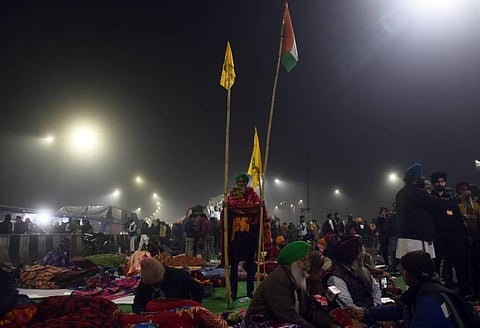 Farmers gather at the site along a blocked highway during a demonstration against the central government's recent agricultural reforms. (Photo | Parveen Negi/EPS)