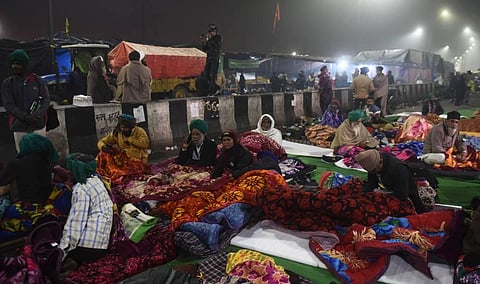 Farmers gather at the site along a blocked highway during a demonstration against the central government's recent agricultural reforms. (Photo | Parveen Negi/EPS)