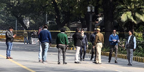 NIA and crime investigation team of Delhi Police inspect the blast site near Israeli Embassy in New Delhi. (Photo | Parveen Negi, EPS)