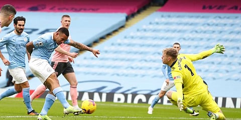 Manchester City's Gabriel Jesus scores his side's goal during the English Premier League match against Sheffield United. (Photo | AP)