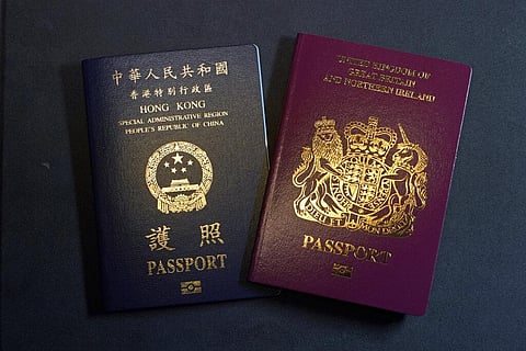 A British National Overseas passports (BNO) and a Hong Kong Special Administrative Region of the People's Republic of China passport are pictured here. (Photo | AP)