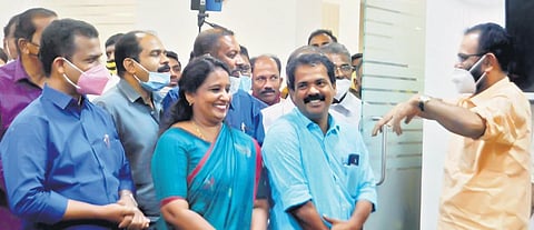Former district panchayat president V K Madhu with new president Suresh Kumar and vice-president A Shylaja Begum. V K Prasanth, MLA, looks on | Express