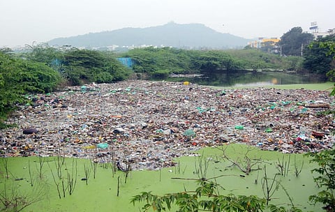 Garbage dumped in the Putheri lake at Pallavaram- Thoraipakkam radial road. (Photo | Ashwin Prasath, EPS)