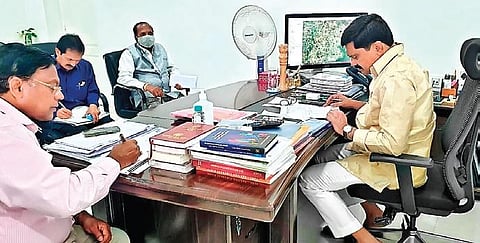 Roads & Buildings Minister Vemula Prashanth Reddy holds a review meeting with officials at his camp office in Hyderabad on Sunday.