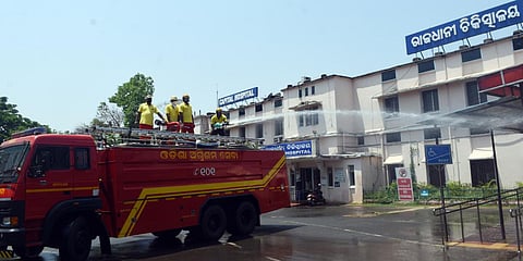 Odisha Fire Service personnel sanitizing campus of Capital Hospita during lockdown in Bhubaneswar on Thursday. (Photo| Biswanath Swain, EPS)