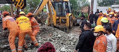 Rescue operation carried out by NDRF personnel after the complex roof of a crematorium collapsed due to heavy rain at Muradnagar in Ghaziabad Sunday Jan. 03 2021. (Photo | PTI)