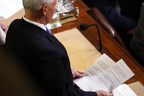 Vice President Mike Pence announces election of President and Vice President as he officiates a joint session of the House and Senate to confirm Electoral College votes at the Capitol. (Photo | AP)