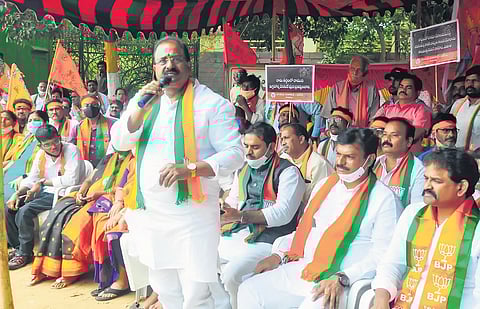 Somu Veerraju speaking at a dharna in Vizag on Wednesday. (Photo | G Satyanarayana, EPS)