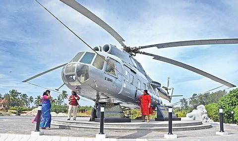 Kanayi Kunhiraman’s Mermaid statue at Shankhumugham alongside which a helicopter has been installed. Placing the helicopter here has kicked up a row  | B P Deepu