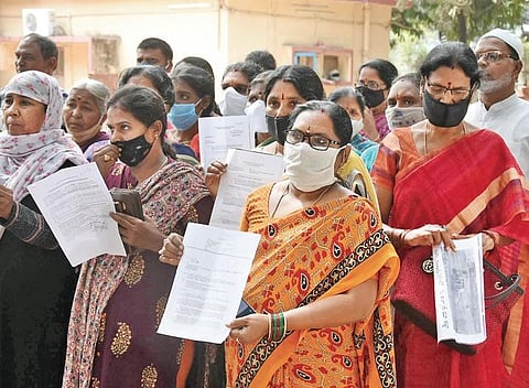 Members of Hafeezpet Land Protection Committee and Subhash Chandra Bose Nagar Welfare Committee address the media on Friday. (Photo | RVK Rao, EPS)