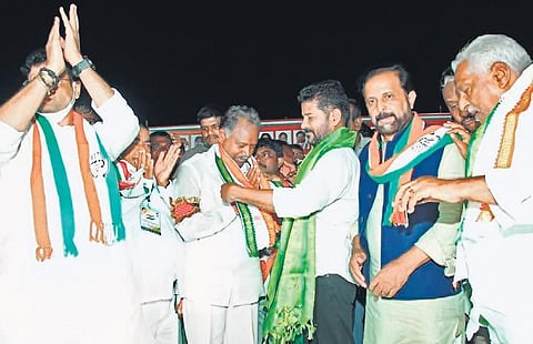 TPCC president A Revanth Reddy welcomes Gandra Satyanarayana Rao into the Congress fold, in Bhupalpally on Thursday.