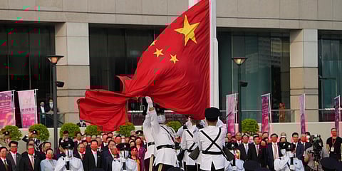 A flag raising ceremony for the celebration of China's National Day is held at the Golden Bauhinia Square, in Hong Kong. (Photo | AP)