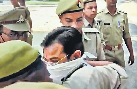 Ashish Mishra arrives at the crime branch office in Lakhimpur Kheri. (Photo | PTI)