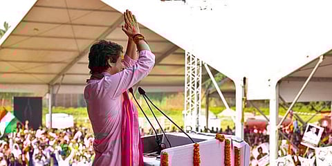 Congress General Secretary Priyanka Gandhi Vadra greets the people during the 'Kisan Nyay Rally', in Varanasi on Sunday. (Photo | ANI)