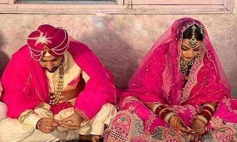 Punjab CM Charanjit Singh Channi's son Navjit with his bride Simrandheer (Photo | Twitter/@GauravPandhi)