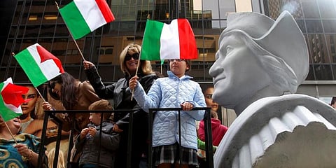 People ride on a float with a large bust of Christopher Columbus during the Columbus Day parade in New York. (Photo | AP)