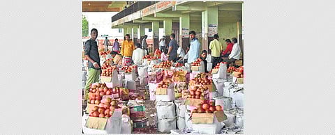 Traders pack up their wares on the last day that they were allowed to ply at Gaddianaram fruit market in Hyderabad.