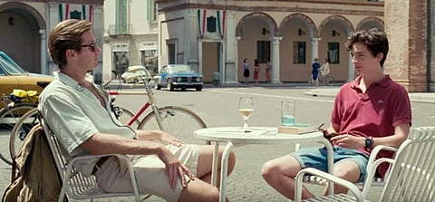 A still from 'Call Me by Your Name' featuring Armie Hammer (L) and Timothee Chalamet (R).