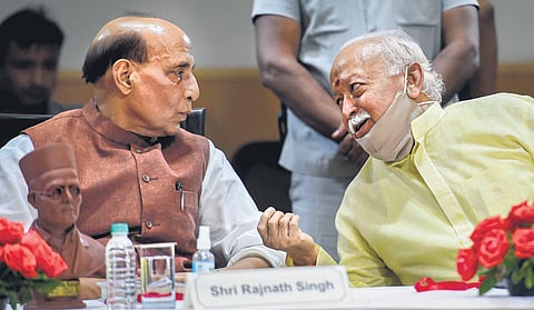 Defence minister Rajnath Singh, RSS head Mohan Bhagwat at the book launch. (Photo | PTI)