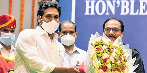 Andhra Pradesh CM YS Jagan Mohan Reddy greets Justice Prashant Kumar Mishra during the later’s swear-in ceremony in Vijayawada on Wednesday. (Photo | EPS)