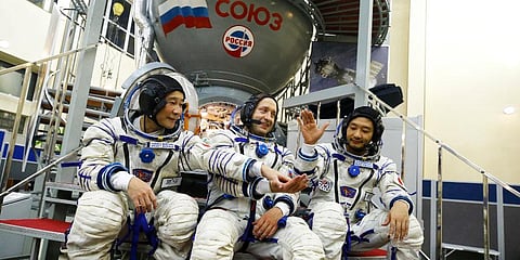 Roscosmos cosmonaut Alexander Misurkin (C), space flight participants Yusaku Maezawa (L) and Yozo Hirano ahead of their expedition to the International Space Station. (Photo | AP)