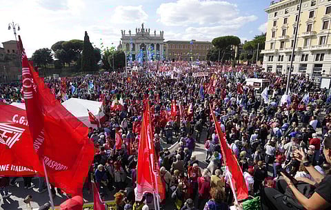 Demonstrators take part in a march organized by Italy's main labor unions, in Rome's St. John Lateran square, Saturday, Oct. 16, 2021. (Photo | AP)