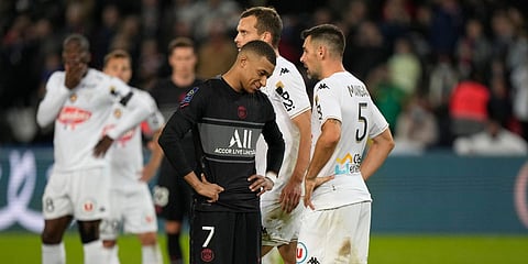 PSG's Kylian Mbappe and Angers' Thomas Mangani during the French League One match at the Parc des Princes in Paris. (Photo| AP)
