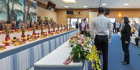 Taiwanese President Tsai Ing-wen, right, pays her respect to those who died in a building fire at a morgue in Kaohsiung, southern Taiwan, Saturday, Oct 16, 2021. (Photo | AP)