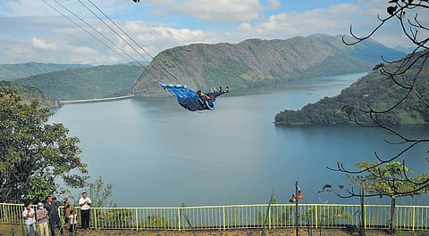 Visitors enjoying the giant swing ride at the adventure tourism park of DTPC near Idukki dam on Friday. Although the authorities had issued a blue alert after the water level in the dam reached 2,390