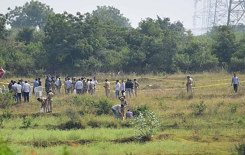 Policemen stand guard the area where four accused in the rape-and-murder case were shot dead by the police. (File | PTI)