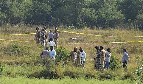 Policemen stand guard the area where four accused in the rape-and-murder case were shot dead by the police. (File | PTI)