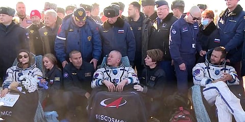 Russian space agency cosmonaut Oleg Novitskiy (C), actress Yulia Peresild (L) and film director Klim Shipenko after the landing of the Russian Soyuz MS-18 space capsule in Kazakhstan. (Photo| AP)