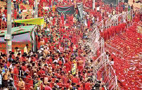 Bhavani Deeksha devotees at the ghat, where showers were arranged during Dasara  in Vijayawada. (Photo | Prasant Madugula, EPS)