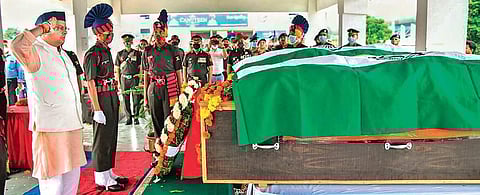 Uttarakhand CM Pushkar Singh Dhami pays homage to Subedar Ajay Singh Rautela and Naik Harendra Singh, who were killed by militants in Poonch. (Photo| PTI)
