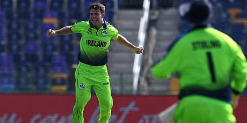 Ireland's Curtis Campher celebrates after taking the wicket of Netherland's Scott Edwards. (Photo | AFP)